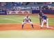Baseball players on the field at a stadium, with branded signage in the background and an active game at 6062 Spinnaker Blvd, Englewood, FL 34224