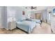 Bright bedroom featuring a bed, tile flooring, and sliders to the lanai at 6062 Spinnaker Blvd, Englewood, FL 34224