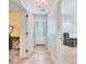 The tiled foyer leads to a bedroom and a living room area at 6062 Spinnaker Blvd, Englewood, FL 34224