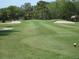 Scenic golf course showcasing meticulously maintained greens and sand traps at 6062 Spinnaker Blvd, Englewood, FL 34224