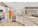 Spacious kitchen with granite countertops, stainless steel appliances, and modern cabinetry at 6062 Spinnaker Blvd, Englewood, FL 34224