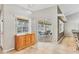 Open-concept kitchen area with view of lanai area and pool through sliding glass doors at 6062 Spinnaker Blvd, Englewood, FL 34224