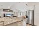 Modern kitchen featuring granite countertops, stainless steel appliances, and ample cabinet space at 6062 Spinnaker Blvd, Englewood, FL 34224