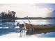 Dog with a canoe by the lake, creating a serene outdoor scene at 6062 Spinnaker Blvd, Englewood, FL 34224