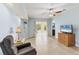 A comfortably furnished living room offers lots of light and space at 6062 Spinnaker Blvd, Englewood, FL 34224