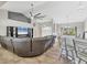 Open-concept living room that seamlessly connects the kitchen and dining areas at 6062 Spinnaker Blvd, Englewood, FL 34224