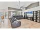 Bright living room showcasing the open layout, media center, and large windows at 6062 Spinnaker Blvd, Englewood, FL 34224