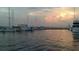 Picturesque marina with yachts at dusk, reflected in calm water at 6062 Spinnaker Blvd, Englewood, FL 34224