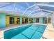 A beautiful pool with dining space and view of the water at 6062 Spinnaker Blvd, Englewood, FL 34224