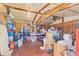 Interior of a storage unit with exposed beams and packed full of household items at 6062 Spinnaker Blvd, Englewood, FL 34224