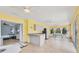 Spacious sunroom features tile flooring, casual dining, and counter with sink at 6062 Spinnaker Blvd, Englewood, FL 34224