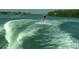 Person water skiing on a sunny day in the ocean at 6062 Spinnaker Blvd, Englewood, FL 34224