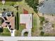 A top-down aerial view showing the home and its well manicured lawn in its neighborhood at 6305 Shalimar St, Port Charlotte, FL 33981