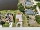 Residential area with houses, roads, and a peaceful lake at 6305 Shalimar St, Port Charlotte, FL 33981