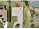 An aerial view of a single-story home shows manicured landscaping, gray roof and a circular driveway at 6305 Shalimar St, Port Charlotte, FL 33981