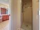 View into a bathroom with shower, and to the vanity with a sink at 6305 Shalimar St, Port Charlotte, FL 33981