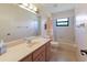Bathroom with a bathtub-shower, toilet and vanity with a sink at 6305 Shalimar St, Port Charlotte, FL 33981