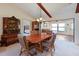 Dining room with wood table and view into the living room and a bedroom at 6305 Shalimar St, Port Charlotte, FL 33981