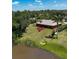 Charming single-story home with a well-manicured lawn and a view of the adjacent lake at 6305 Shalimar St, Port Charlotte, FL 33981