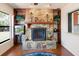 Living room features a stone fireplace with built-in shelves and accents at 6305 Shalimar St, Port Charlotte, FL 33981