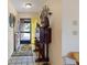Bright and welcoming foyer with neutral walls and beautiful tile flooring, plus view through to the front yard at 6305 Shalimar St, Port Charlotte, FL 33981