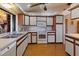 Kitchen with view of sink, stove and microwave with ample counter space at 6305 Shalimar St, Port Charlotte, FL 33981