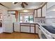 Bright kitchen featuring white appliances, countertops, and ample cabinet space at 6305 Shalimar St, Port Charlotte, FL 33981