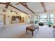 Bright, open living room with vaulted ceilings, exposed beams, and large windows at 6305 Shalimar St, Port Charlotte, FL 33981