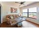 Cozy living room with a large window overlooking a serene lake view at 6305 Shalimar St, Port Charlotte, FL 33981