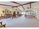 Spacious living room with vaulted ceilings, exposed beams, and an open floor plan at 6305 Shalimar St, Port Charlotte, FL 33981