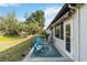 Backyard featuring well-maintained lawn and patio with seating at 667 Foxwood Blvd, Englewood, FL 34223