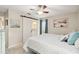 Bedroom view featuring sliding door entry to ensuite bathroom with a coastal theme at 667 Foxwood Blvd, Englewood, FL 34223