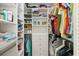 Well-organized walk-in closet with built-in shelving and drawers for optimal storage at 667 Foxwood Blvd, Englewood, FL 34223