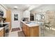 Kitchen featuring stainless steel appliances, white countertops, and an adjacent dining area at 667 Foxwood Blvd, Englewood, FL 34223