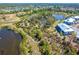 Aerial view of the property, showing lake and surrounding greenery at 6800 Placida Rd # 262, Englewood, FL 34224