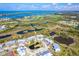 Overhead view of property near waterway, golf course, and tennis court at 6800 Placida Rd # 262, Englewood, FL 34224