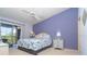 Bright primary bedroom with vaulted ceilings and access to the cozy screened lanai at 6800 Placida Rd # 262, Englewood, FL 34224