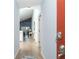 Inviting entryway showing wood-look flooring and light blue walls leading to the open living space at 6800 Placida Rd # 262, Englewood, FL 34224
