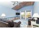 Living room with water damaged ceiling with view to a balcony at 6800 Placida Rd # 262, Englewood, FL 34224