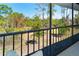 Peaceful porch view overlooking a sprawling landscape of trees and natural beauty at 6800 Placida Rd # 262, Englewood, FL 34224