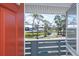 Relaxing view of a pond and palm trees from the unit's porch at 6800 Placida Rd # 262, Englewood, FL 34224
