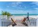 Outdoor balcony boasts incredible ocean views, lounge chairs, and a telescope for viewing at 7554 Palm Island S Dr # 1822, Placida, FL 33946