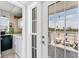 The laundry room provides access to the balcony which provides stunning views of the beach and neighborhood at 7554 Palm Island S Dr # 1822, Placida, FL 33946