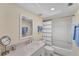 Clean bathroom with a white vanity, large mirror, and a shower-tub combination at 7554 Palm Island S Dr # 1822, Placida, FL 33946