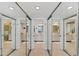 A mirrored closet reflects a bathroom with double vanity and tile flooring at 7554 Palm Island S Dr # 1822, Placida, FL 33946