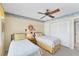 Bedroom featuring twin beds, a ceiling fan, and closet at 7554 Palm Island S Dr # 1822, Placida, FL 33946