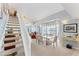 Bright dining area features a glass top table, seating for six, and beautiful views from the large bay window at 7554 Palm Island S Dr # 1822, Placida, FL 33946