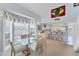 Bright dining area with a glass table adjacent to a window and open to a kitchen with barstool seating at 7554 Palm Island S Dr # 1822, Placida, FL 33946