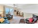 Inviting living room with a comfortable seating arrangement and sliding glass doors leading to a balcony at 7554 Palm Island S Dr # 1822, Placida, FL 33946