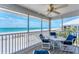 Screened-in porch with comfortable seating and stunning ocean views at 7554 Palm Island S Dr # 1822, Placida, FL 33946